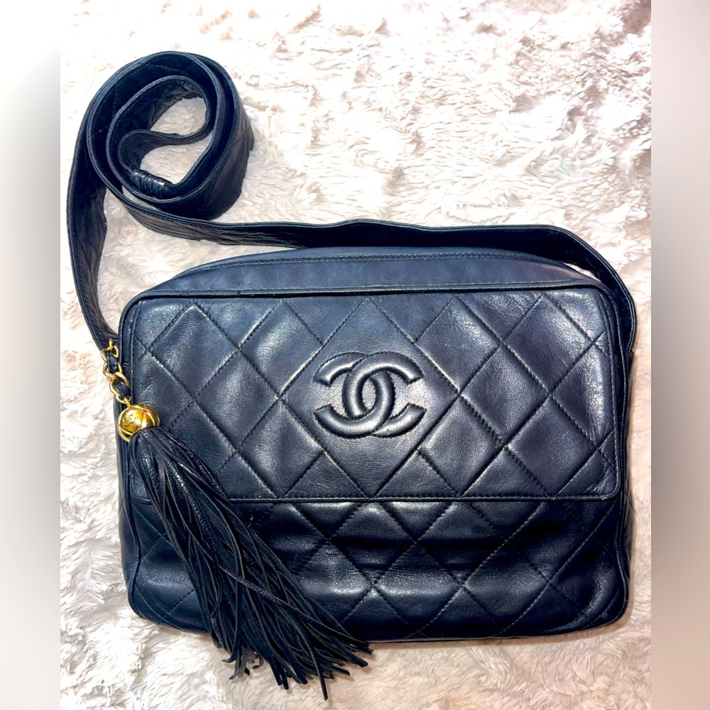 Authentic black leather Chanel crossbody bag with tassel